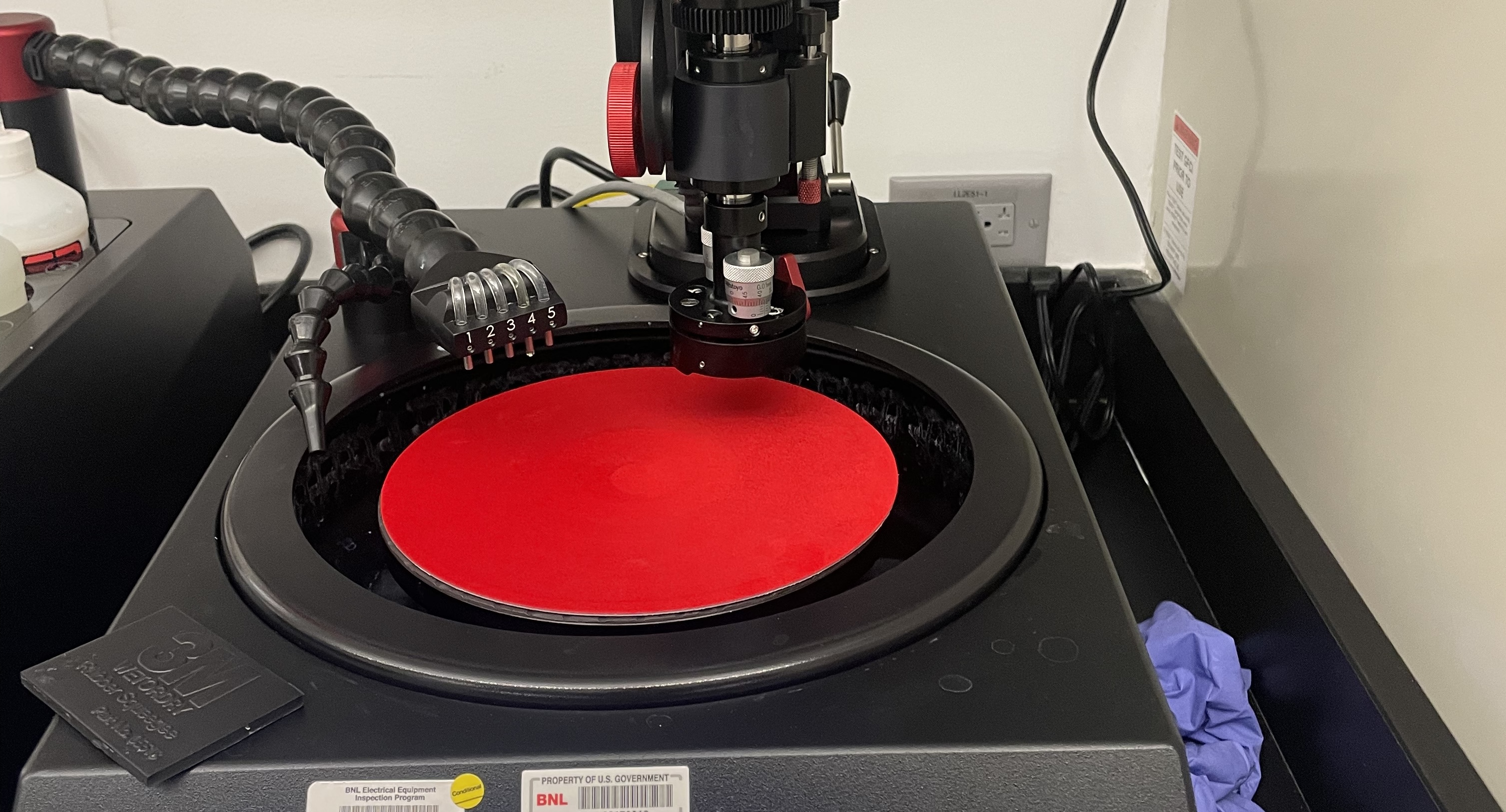 Polisher with magnetic platen and felt installed.